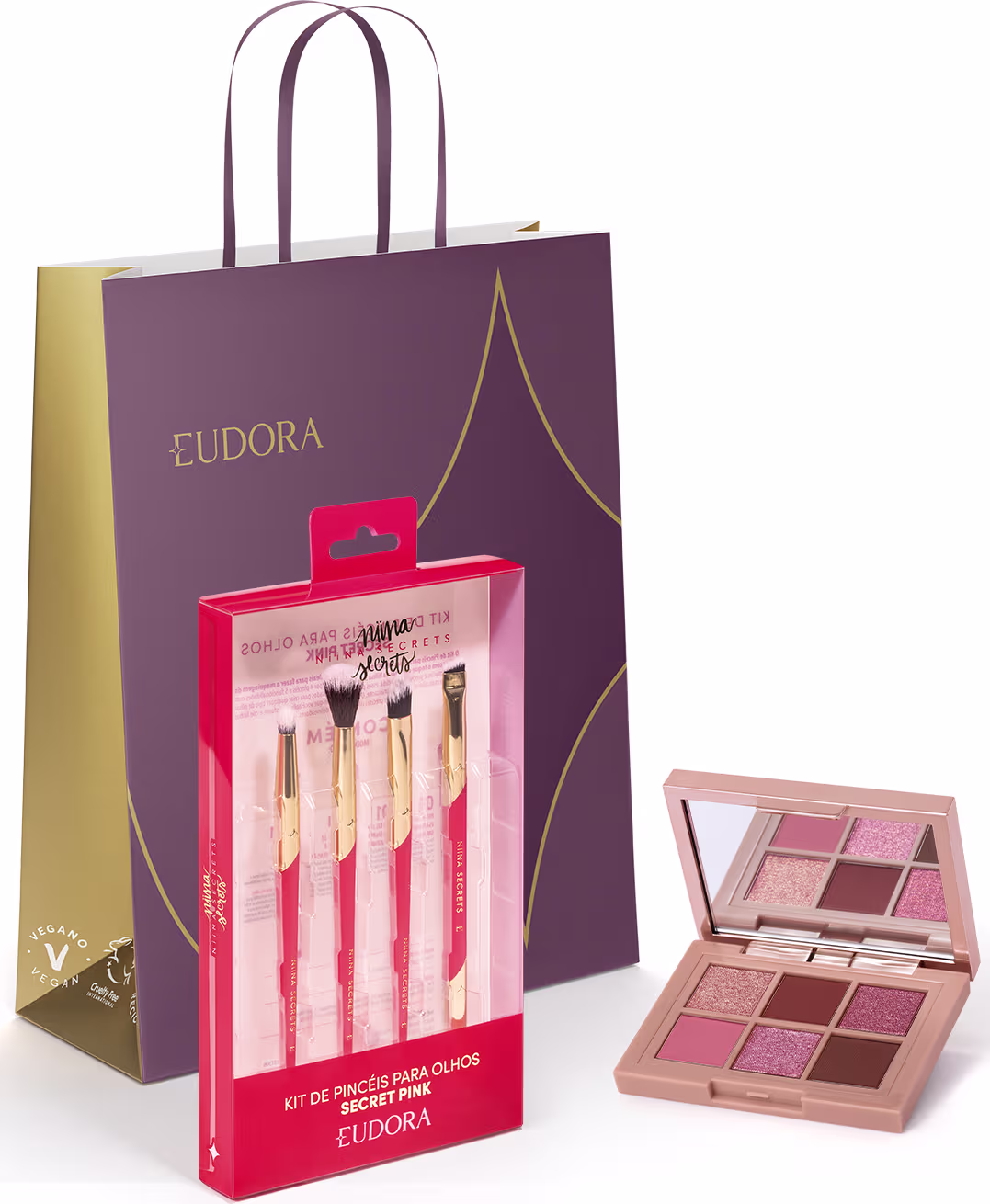 Conjunto de pincéis para olhos da marca Eudora em embalagem vermelha, acompanhado de paleta de sombras em tons rosados e marrons em caixa com logotipo da marca em fundo roxo.