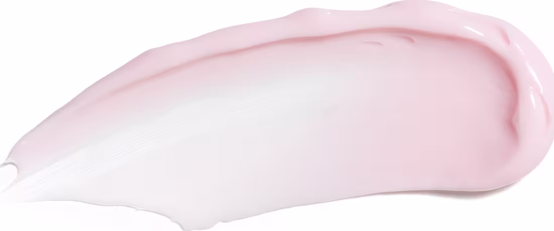 Textura do creme ou loção cosmética de cor rosa e branca. Possui uma forma arredondada e suave, com uma textura cremosa e brilhante. Não é possível identificar qualquer texto ou rótulo visível na imagem.