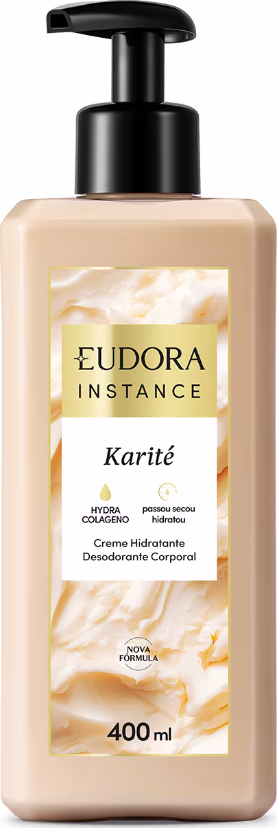 Frasco de creme hidratante corporal da linha Instance da Eudora, com embalagem plástica preta e rótulo amarelo destacando o ingrediente Karité. O produto possui 400 ml de volume.