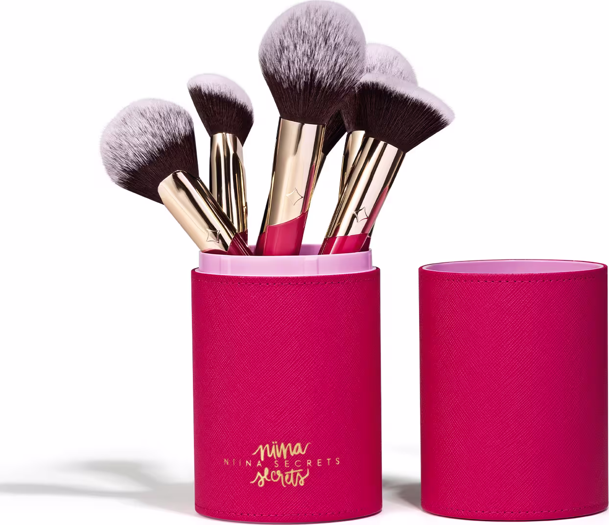Conjunto de pincéis de maquiagem da marca Niina Secrets em embalagem cilíndrica rosa Estojo Organizador para Pincéis Pink Case Niina Secrets, contendo diversos pincéis com cerdas pretas e douradas.