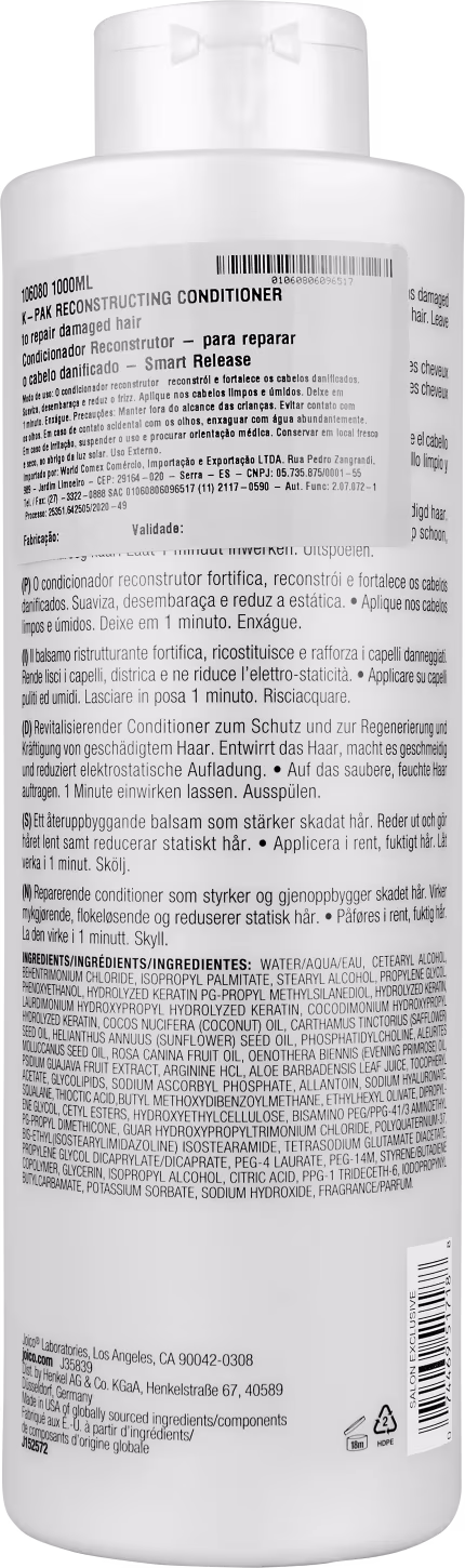 Condicionador reconstrutivo Joico K-Pak. Embalagem plástica branca cilíndrica. Rótulo detalhado com informações do produto em vários idiomas, incluindo ingredientes, instruções de uso e avisos.