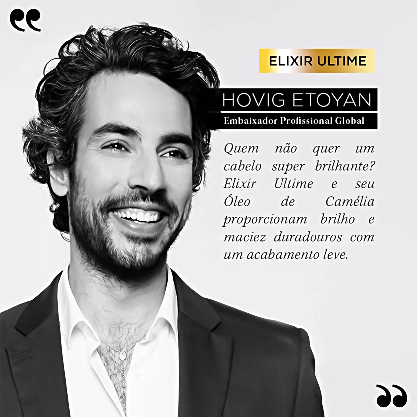 A imagem mostra Hovig Etoyan, embaixador da Kérastase, um homem sorridente com cabelos cacheados e barba, vestindo um terno preto e camisa branca. O texto destaca que o elixir e o óleo de camelia proporcionam brilho e maciez com acabamento leve