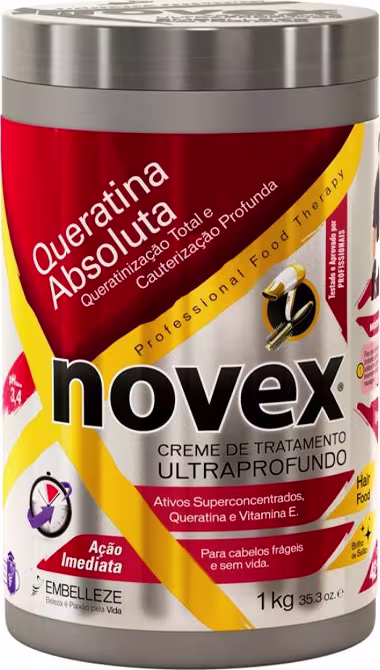 A imagem mostra o Creme de Tratamento Novex Queratina Absoluta 1kg da marca Embelleze. O pote é vermelho, amarelo e prateado. Traz a indicação para cauterização profunda de cabelos frágeis e sem vida.