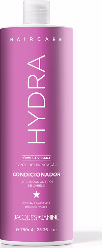 Frasco de condicionador da linha Haircare da marca Jacques Janine Professionnel, com embalagem rosa e branca, apresentando a fórmula vegana e a indicação de ser para todos os tipos de cabelo.