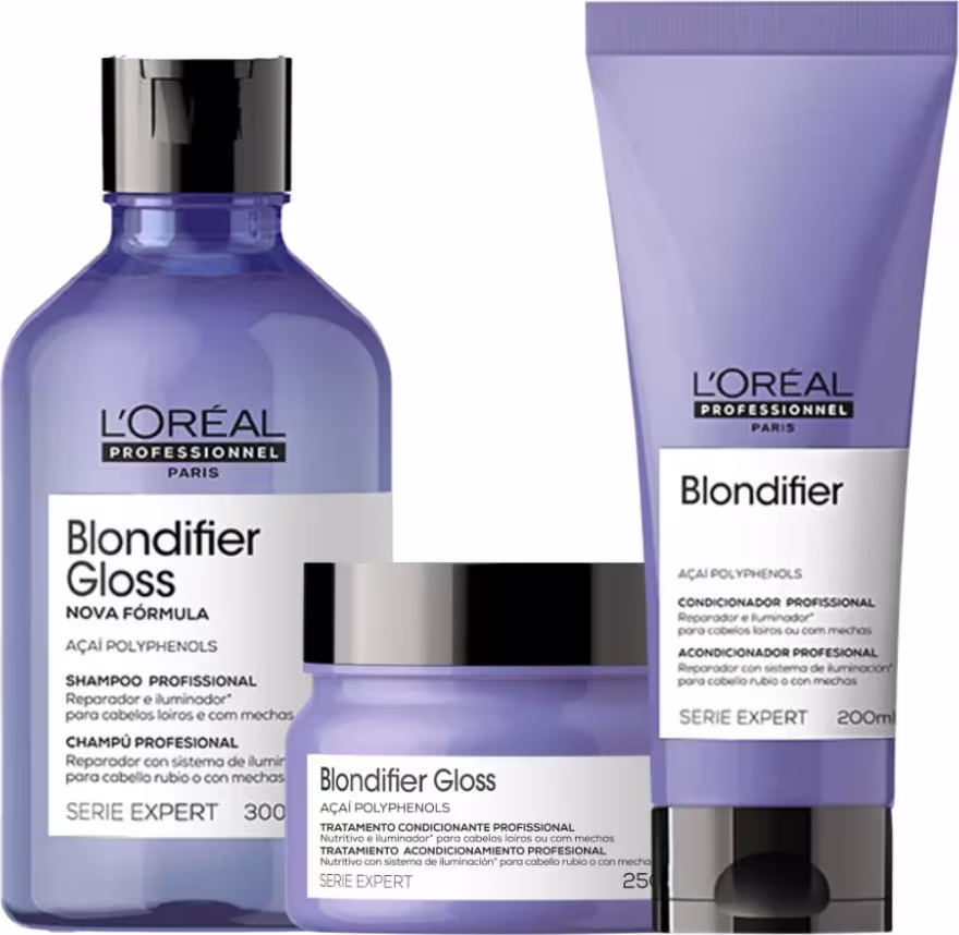 A imagem mostra três produtos da linha Blondifier da L'Oréal Professionnel. Um shampoo em um frasco azul transparente de 300ml, um condicionador em um tubo roxo opaco de 200ml e uma máscara em pote redondo azul. Todos possuem tampa preta.
