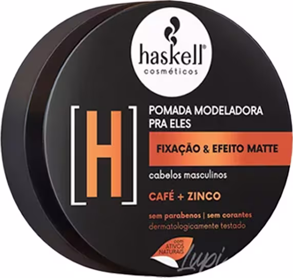 Pomada modeladora para cabelos masculinos Haskell. A embalagem é um recipiente preto redondo com um rótulo branco e laranja. O rótulo indica que a pomada possui fixação e efeito matte, além de conter ingredientes como café e zinco.