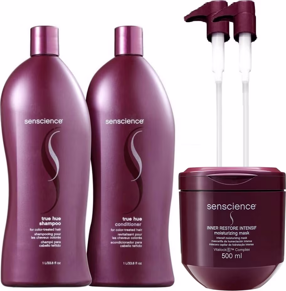 A imagem mostra dois frascos grandes de plástico na cor vinho com shampoo e condicionador. Há também um pote arredondado com a mesma tonalidade que traz a máscara capilar. Por fim, dois aplicadores de plástico branco com bombas dosadoras vinho.