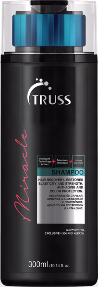 A imagem mostra um pote grande e preto de shampoo da TRUSS.