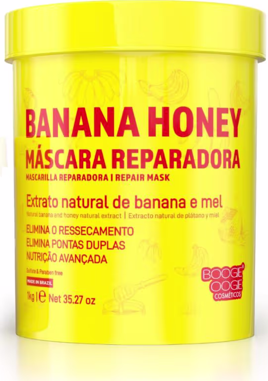 Pote amarelo contendo máscara reparadora de banana e mel. Rótulo em vermelho e amarelo destaca os ingredientes naturais e benefícios do produto, como nutrição avançada e eliminação de ressecamento e pontas duplas.