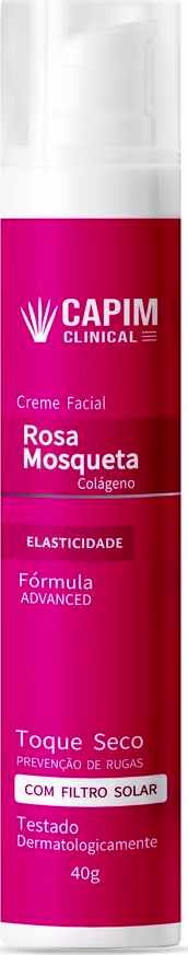Embalagem cilíndrica plástica transparente com tampa branca. Rótulo frontal rosa intenso com detalhes em branco. Destaca-se o nome do produto "Rosa Mosqueta Colágeno" e os benefícios "Elasticidade" e "Fórmula Advanced".