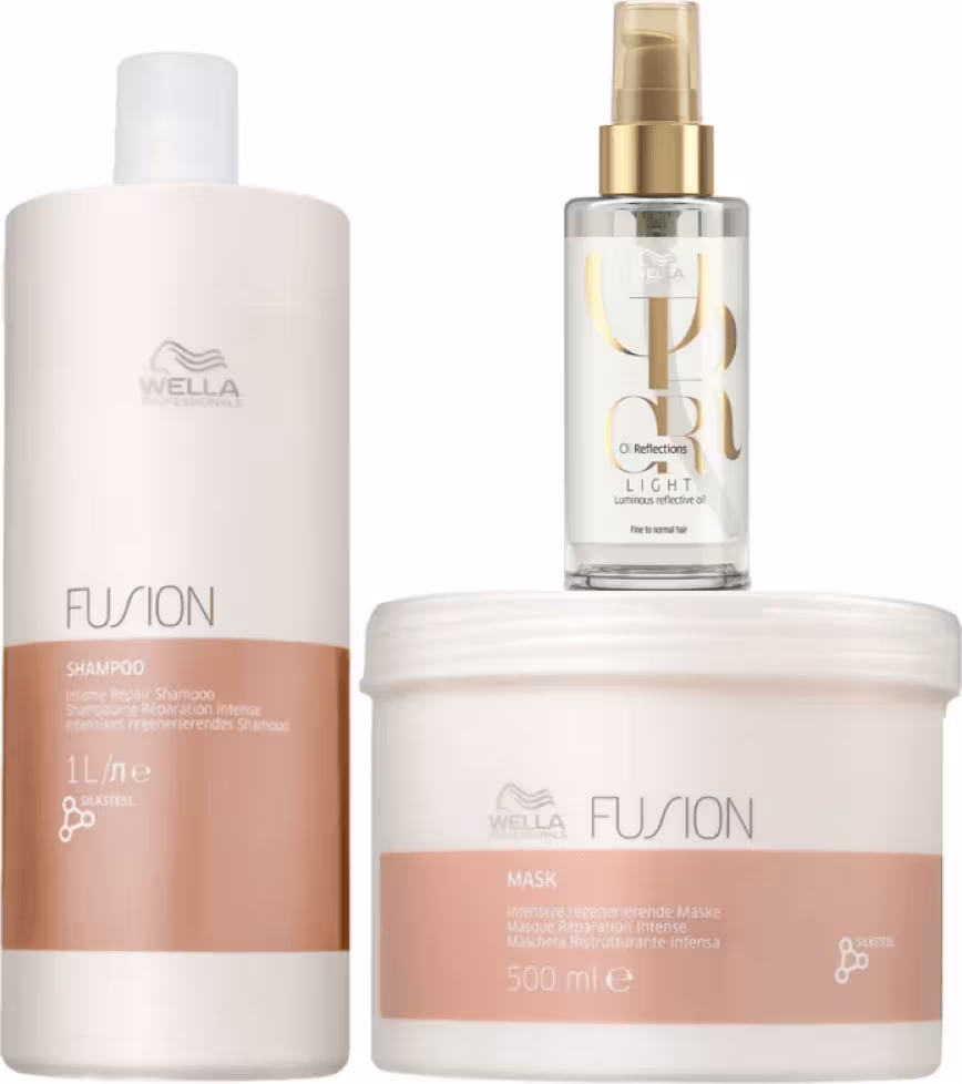 A imagem mostra um shampoo em uma embalagem branca e cobre, uma máscara em um pote branco e cobre, e um óleo capilar em um frasco transparente com detalhes dourados.