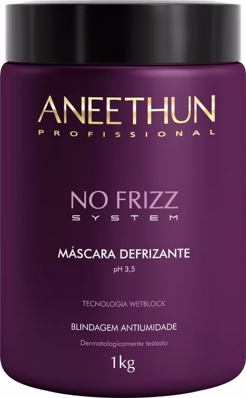 A imagem mostra um pote cilíndrico grande da máscara. Sua cor é roxa escura com detalhes em dourado e branco e tampa preta.