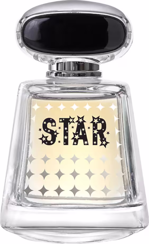 Frasco de perfume de vidro transparente com tampa preta, exibindo o texto "STAR" em letras estilizadas e decoradas com estrelas em fundo claro. O design é elegante e minimalista, com destaque para a marca.