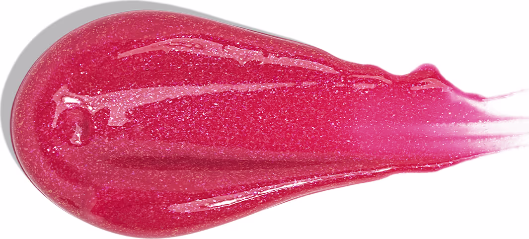 A imagem traz uma amostra do gloss labial com acabamento brilhante e cor rosa cereja cintilante.