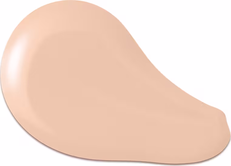 O produto apresentado na imagem é uma base de maquiagem de cor bege clara, com uma textura cremosa e suave. Sua forma é arredondada e convexa. Não há rótulos, marcas ou outras informações visíveis na imagem.