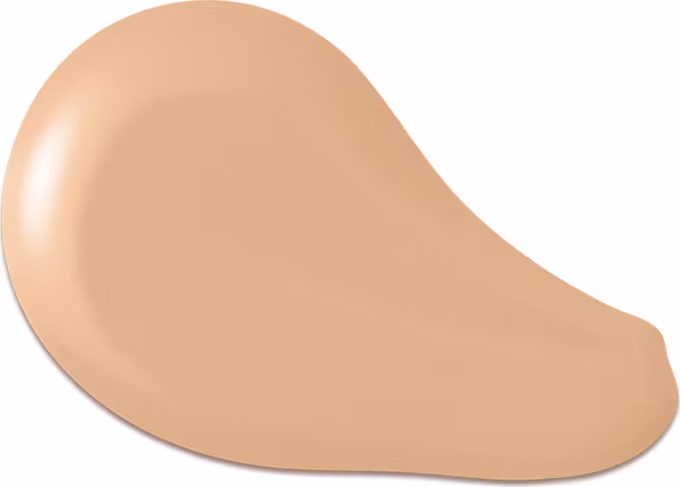O produto apresentado na imagem é uma base de maquiagem de cor bege, com uma textura cremosa e suave. Sua forma é arredondada e convexa. Não há rótulos, marcas ou outras informações visíveis na imagem.