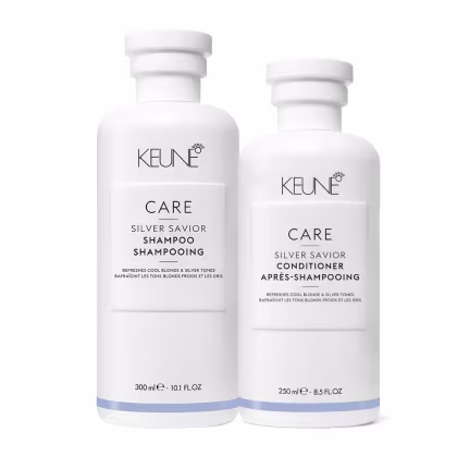 Dois frascos brancos da linha Care da Keune, um de shampoo Silver Savior e outro de condicionador Silver Savior, ambos com rótulos em preto e azul claro indicando o tipo de produto.
