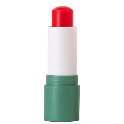 A imagem mostra uma embalagem com a base verde e corpo branco. Na ponta aparece a cor laranja do balm labial.
