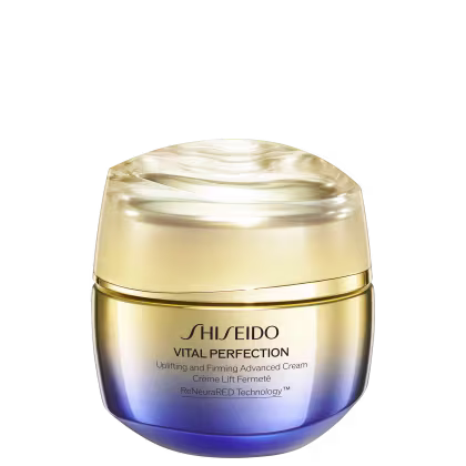 Creme antirrugas e firmador da linha Vital Perfection da Shiseido. Embalagem redonda com tampa dourada. O frasco tem uma coloração azul escura na base que se torna mais clara em direção ao topo.
