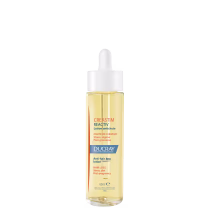 A imagem mostra um frasco transparente contendo um líquido amarelo claro. É o "Creastim Reactiv", da marca Ducray. Trata-se de uma loção antiqueda de cabelo. O frasco tem um aplicador em formato de conta-gotas na parte superior e 60ml de produto.