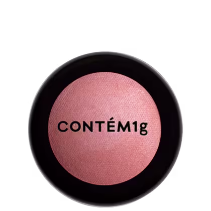 A imagem mostra uma embalagem fechada de blush. A embalagem é preta com parte transparente e o logo da marca em preto.