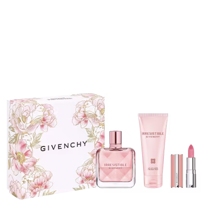 Conjunto de produtos de beleza da marca Givenchy, incluindo um frasco de perfume Irresistible, um tubo de creme corporal e um batom rosa, todos embalados em uma caixa decorada com flores em tons de rosa e prateado.