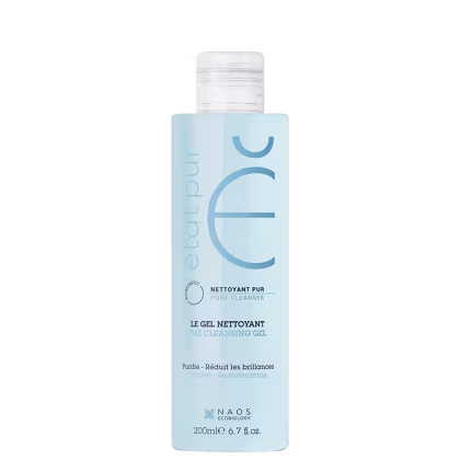 Frasco de item de perfumaria de cor azul claro com rótulo branco. O rótulo exibe o nome da marca "Naos" e o texto "Le gel nettoyant" (O gel de limpeza). O frasco possui uma tampa branca e contém 200 ml do produto.