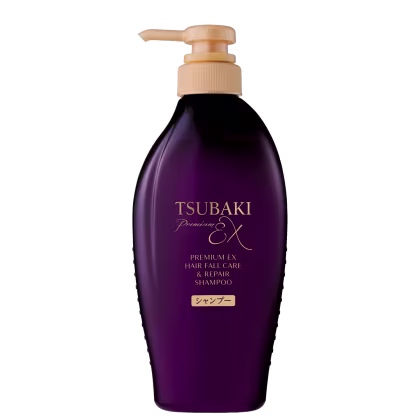 Frasco de shampoo Tsubaki Premium EX de 450 ml, com embalagem roxa e detalhes dourados, apresentando bomba dosadora.