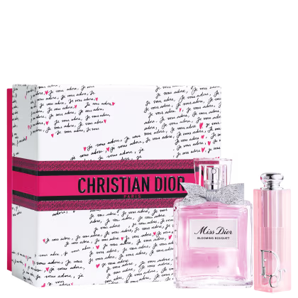 Caixa rosa com logotipo da Christian Dior Paris e frasco de perfume Miss Dior Blooming Bouquet e lip balm Dior Addict