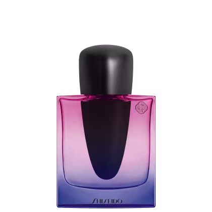 Frasco de perfume Shiseido com design moderno e elegante. Embalagem em tons de rosa e azul, com tampa preta. Rótulo com logotipo da marca visível.