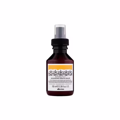 Frasco de 100 ml de um selador nutritivo de queratina da marca Davines, com rótulo em tons de laranja e preto, contendo informações sobre o produto.