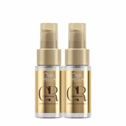 Dois frascos dourados da linha Wella Professionals Oil Reflections, contendo um óleo suavizante luminoso. Os frascos possuem bombas doseadoras e rótulos com o nome da linha e da marca.