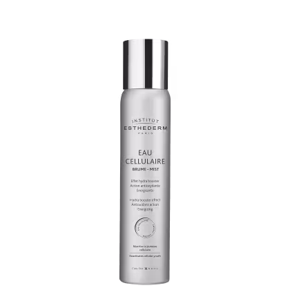 Frasco de névoa celular da marca Institut Esthederm Paris, com design elegante em tons de branco e prata. O rótulo destaca o nome "Eau Cellulaire" e menciona os benefícios de hidratação e ação antioxidante do produto.