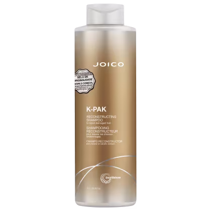 Frasco de shampoo reconstrutor da marca Joico, com rótulo dourado e branco, contendo 1 litro do produto "K-Pak" para reparar cabelos danificados.