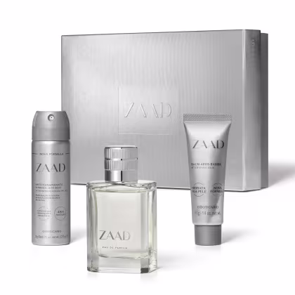 Conjunto de produtos da marca Zaad, incluindo um frasco de perfume, um desodorante em aerossol e um bálsamo pós-barba, todos em embalagens prateadas com o logotipo da marca.