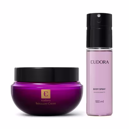 A imagem mostra dois produtos da marca Eudora: um creme corporal em um pote arredondado de vidro roxo profundo com tampa preta e o logotipo dourado da Eudora. O outro é um body spray desodorante corporal de 100ml com líquido lilás.