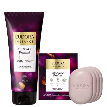 O produto de beleza Instance da Eudora consiste em um creme hidratante corporal em embalagem de 180 ml com rótulo roxo e dourado, além de 4 sabonetes vegetais em barra perfumada.