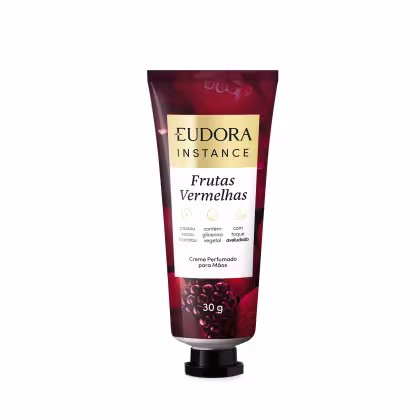 Creme perfumado para mãos da linha Instance da Eudora, com embalagem de 30g em tubo plástico vermelho escuro, destacando o nome da marca e o produto "Frutas Vermelhas" em letras brancas e douradas.