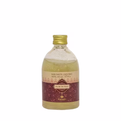 Frasco de sabonete líquido Kailash com rótulo "Flor de Figo", embalagem de vidro com tampa dourada, apresentando uma coloração amarelada e brilhante.