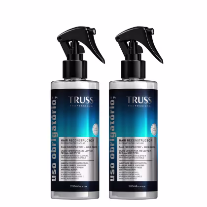 Dois frascos de 260ml do Reconstructor Capilar da linha Truss Professional, com embalagem preta e azul, apresentando rótulo com informações sobre o produto e seu uso.