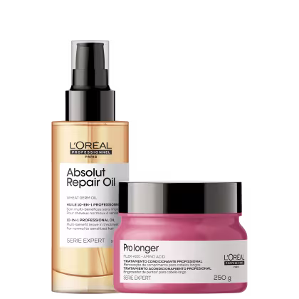 A imagem mostra um óleo capilar e uma máscara capilar. O óleo possui um frasco transparente com aplicador spray e o líquido dourado. Já a máscara capilar vem em um pote de 250g rosa com a tampa preta.