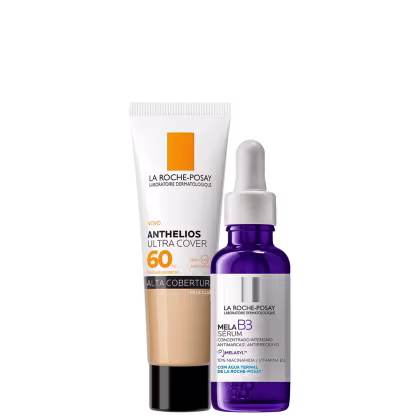 A imagem mostra um protetor solar facial com cor com embalagem tipo bisnaga, ao lado de um frasco de sérum facial com azul, rótulo cinza e conta-gotas branco.