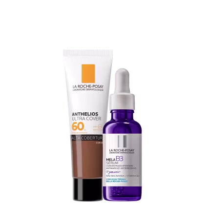 A imagem mostra um protetor solar facial com cor com embalagem tipo bisnaga, ao lado de um frasco de sérum facial com azul, rótulo cinza e conta-gotas branco.