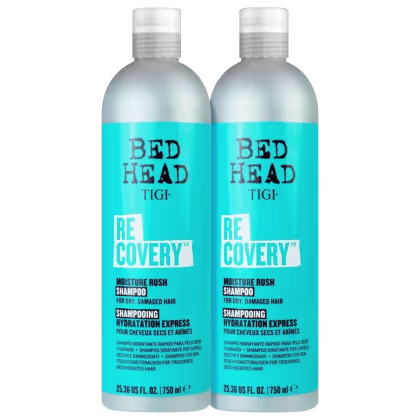 Dois frascos de shampoo TIGI Bed Head Recovery, com embalagem branca e azul, contendo 750 ml cada. O rótulo destaca o nome da linha "Recovery" e a promessa de "Moisture Rush" para cabelos secos e danificados.