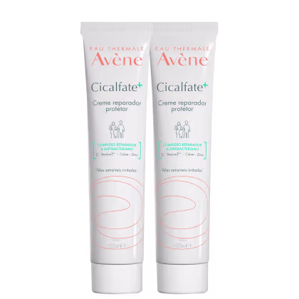 Dois tubos de creme reparador protetor Cicalfate+ da marca Avène, com embalagem branca e detalhes em laranja, contendo 100ml cada. O produto é indicado para peles sensíveis irritadas.