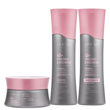 Três produtos da linha Amend Expertise 40+ Prolonga & Regenera: um frasco de shampoo revitalizante, um frasco de condicionador revitalizante e um pote de máscara revitalizante, todos em tons de rosa e cinza.