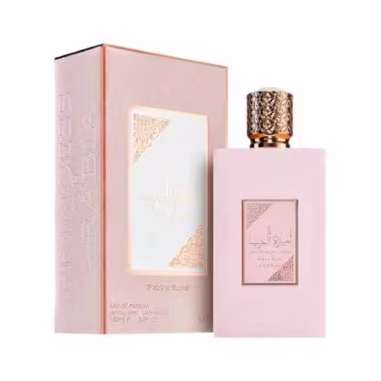 Frasco de perfume Ameerat Al Arab Prive Rose Asdaaf Lattafa com embalagem rosa e detalhes dourados. O frasco possui um design elegante e sofisticado, com tampa decorativa.