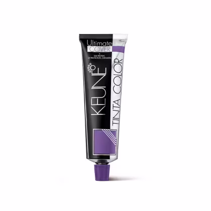 Tubo de creme colorante Keune Tinta Color Ultimate Cover, com embalagem preta e roxa, contendo informações sobre proteção UV e ceramidas.