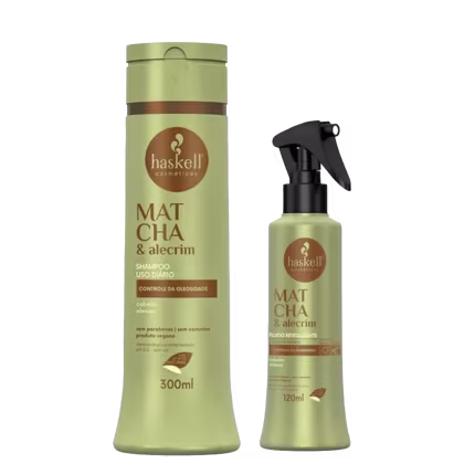 A imagem traz uma embalagem de shampoo e de um fluido revitalizante. Ambos os frascos possuem a cor verde oliva com detalhes e informações destacadas na cor marrom.  O frasco do fluido traz um pulverizador preto na parte superior.