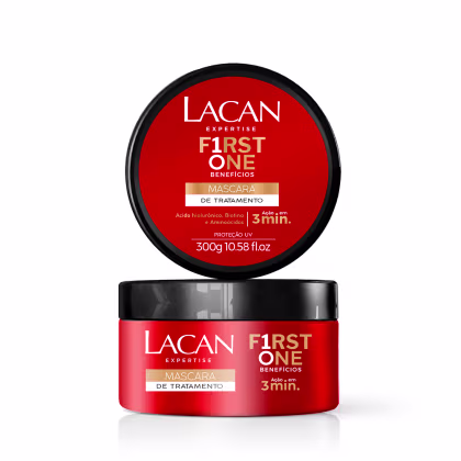 Embalagem preta e vermelha de máscara de tratamento capilar da marca Lacan, com indicação de benefícios em 3 minutos e proteção UV. Frasco de 300g com rótulo destacando a linha "First One Benefícios".